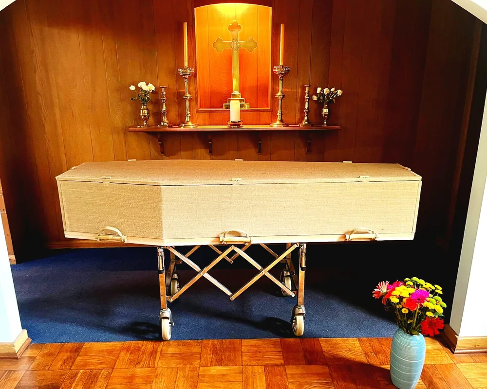 Natural fabric-covered coffin