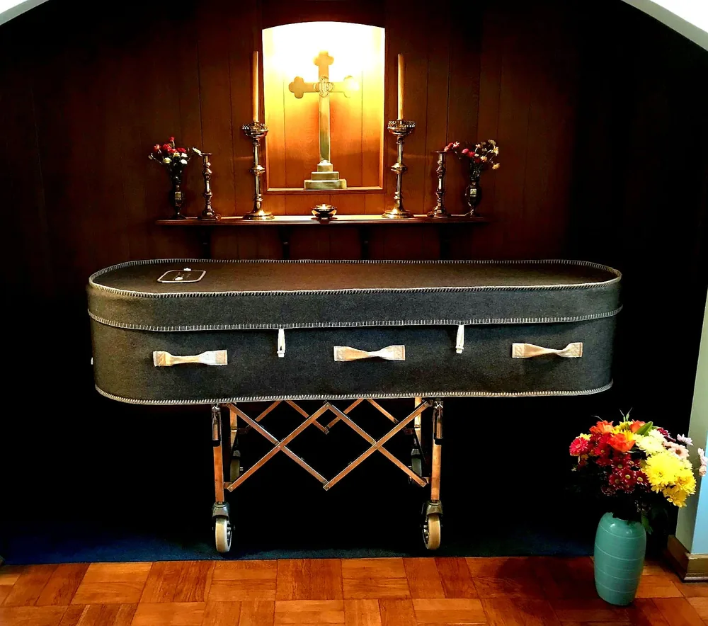 Charcoal fabric-covered coffin